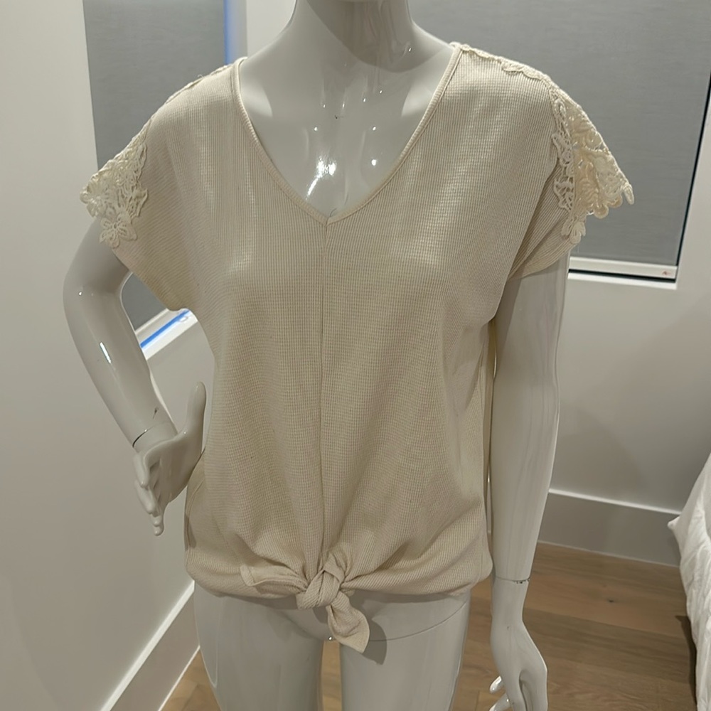 Perfect condition waffle top with tie front and lace sleeves.